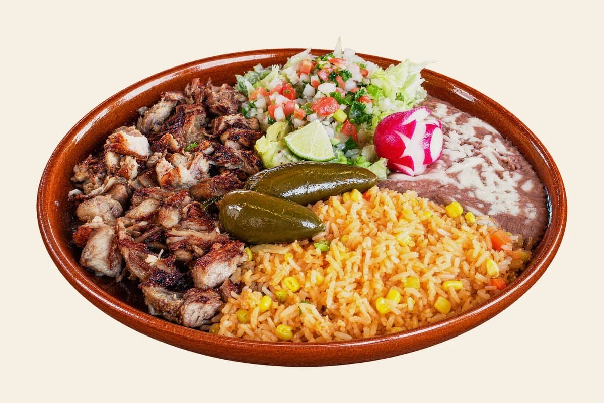 Carnitas plate with Mexican rice, refried beans, pico de gallo, lime, radish and pickled jalapeños